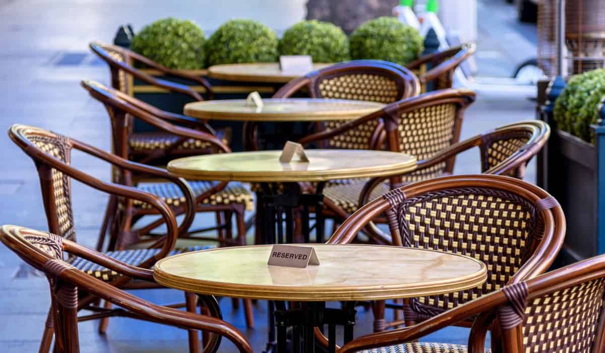 Outdoor café seating in a Melbourne laneway with classic chairs and tables