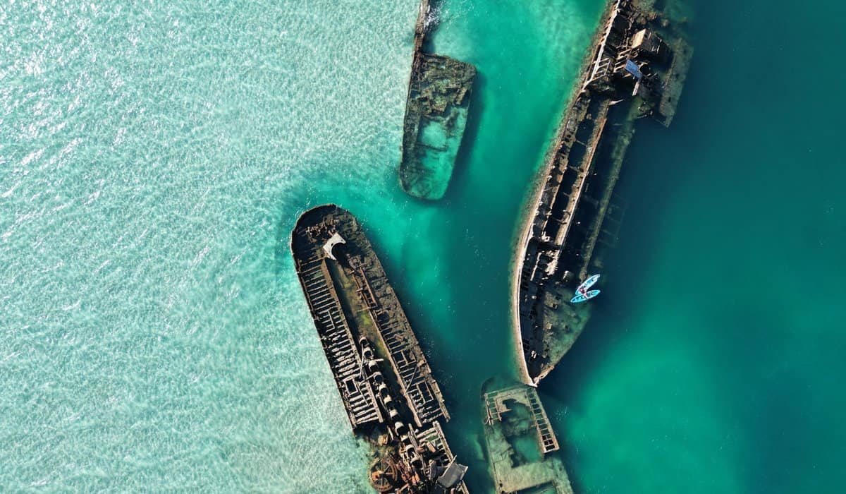 Aerial view of the Tangalooma shipwrecks in clear turquoise water off Moreton Island