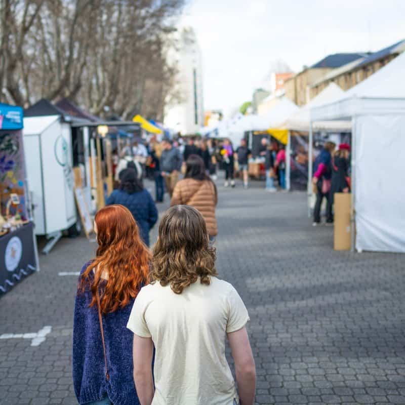 Visitors browsing stalls at Salamanca Market in Hobart, Tasmania